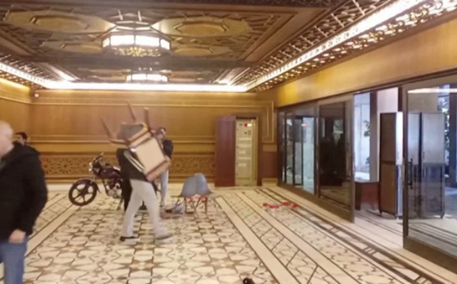 Syrians Invade Assad’s Palaces Amid Political Upheaval